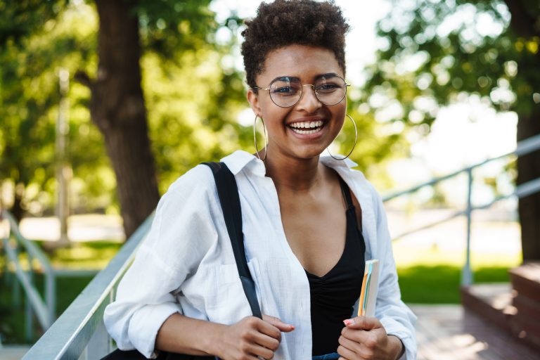 attractive young african young student girl walkin 789564K